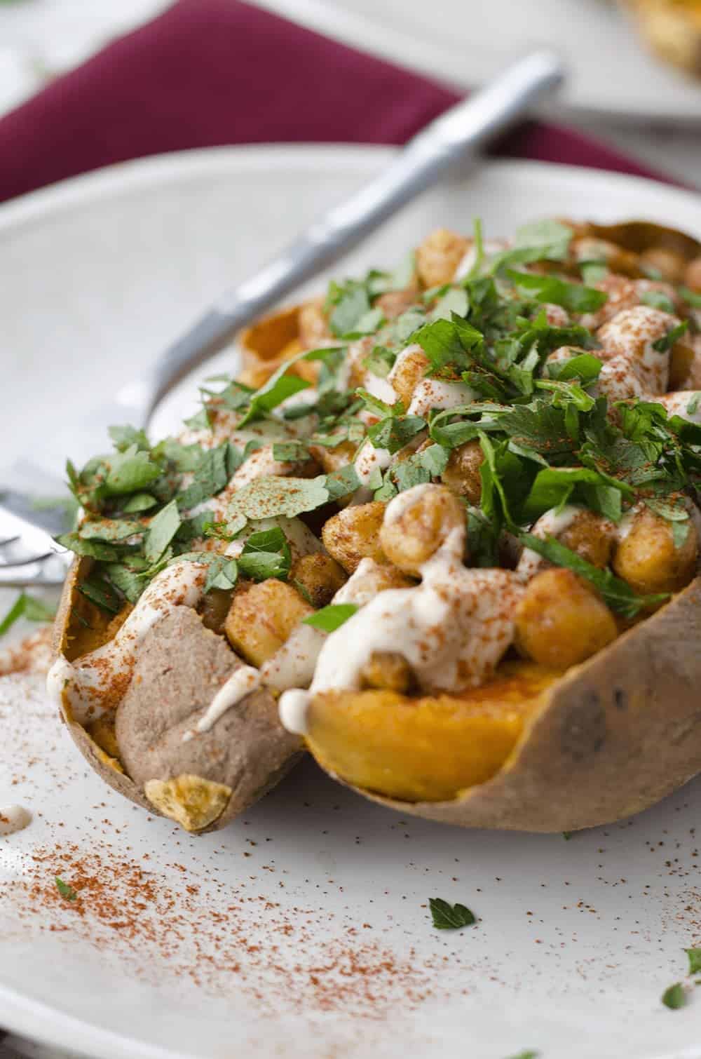 Vegan Stuffed Sweet Potatoes! Roasted Sweet Potatoes Stuffed With Spiced Chickpeas, Garlic Tahini Sauce And Fresh Herbs. Gluten-Free. | Www.delishknowledge.com