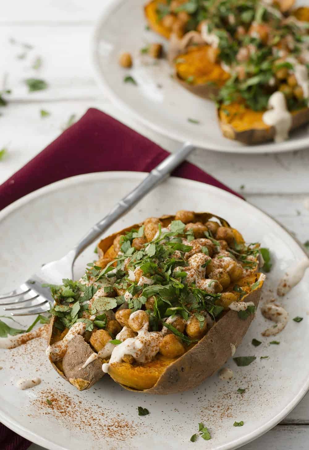 Vegan Stuffed Sweet Potatoes! Roasted Sweet Potatoes Stuffed With Spiced Chickpeas, Garlic Tahini Sauce And Fresh Herbs. Gluten-Free. | Www.delishknowledge.com