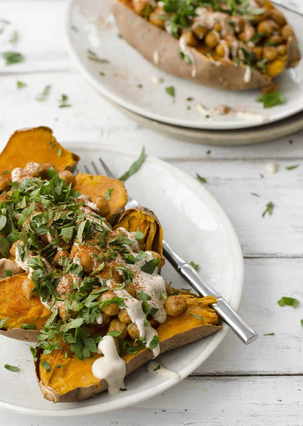 Vegan Stuffed Sweet Potatoes! Roasted Sweet Potatoes Stuffed With Spiced Chickpeas, Garlic Tahini Sauce And Fresh Herbs. Gluten-Free. | Www.delishknowledge.com