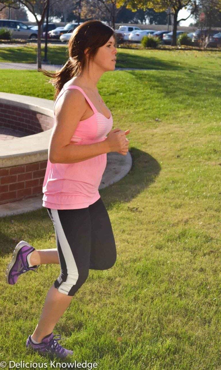 A Woman In Activewear Going The Distance In A Sunny Park Setting During Running Week 2.