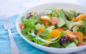 The best salad! Greens tossed with roasted carrots, mandarin oranges, avocados and pumpkin seeds. Vegan & Gluten-Free 