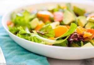 The best salad! Greens tossed with roasted carrots, mandarin oranges, avocados and pumpkin seeds. Vegan & Gluten-Free 