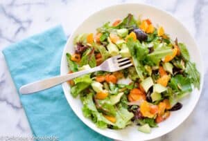 The best salad! Greens tossed with roasted carrots, mandarin oranges, avocados and pumpkin seeds. Vegan & Gluten-Free 