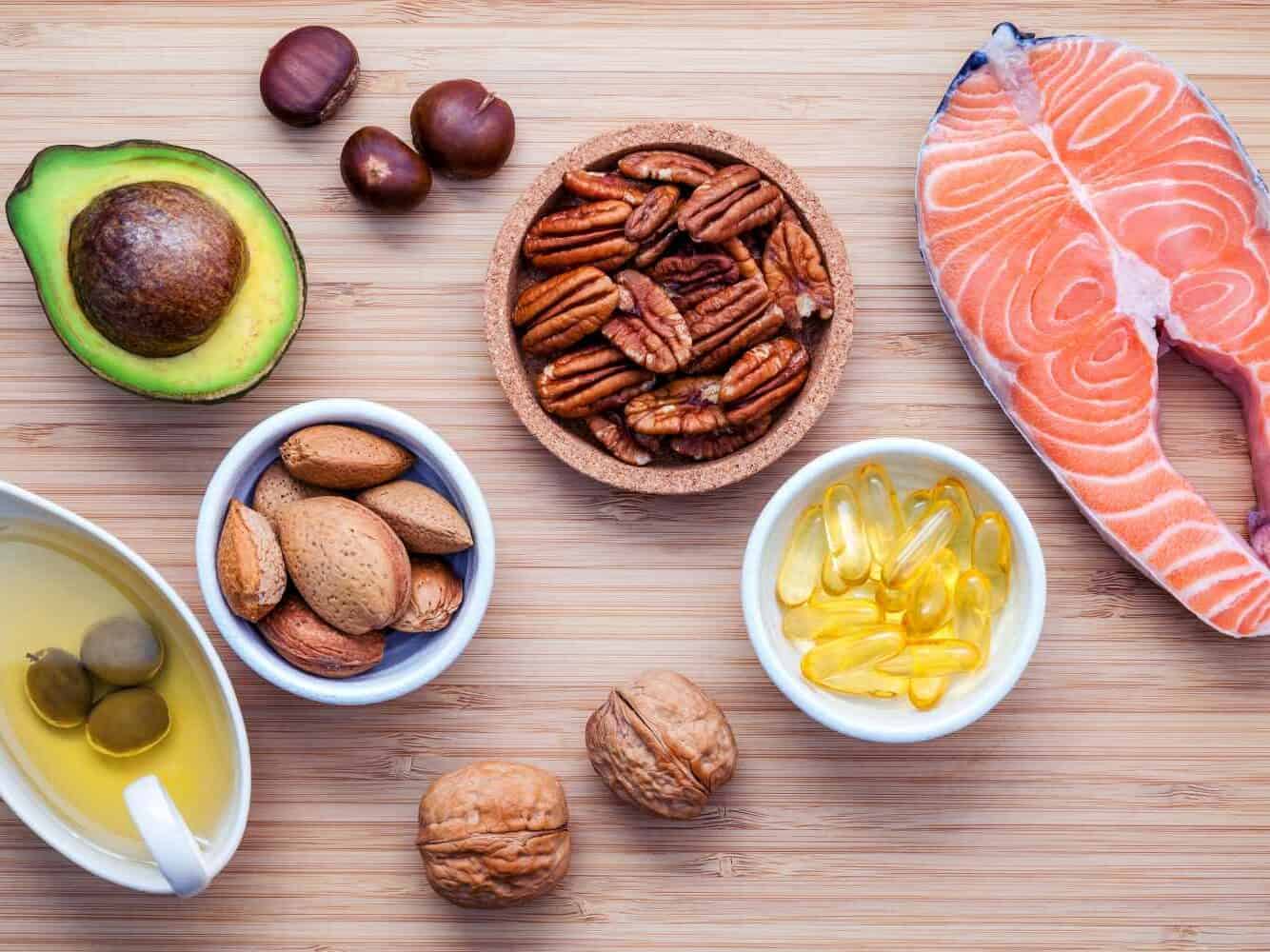Everything You Need to Know about the Mediterranean Diet 3 Almond Pecan Hazelnutswalnuts Olive Oil Fish Oil Salmon On Cutting Board Shutterstock Edited