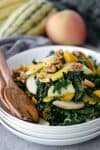 Autumn Squash, Kale and Apple Salad. You've gotta try this Thanksgiving or Holiday salad! Kale, roasted squash, apple and candied walnuts in a maple-cinnamon dressing. #vegan and #glutenfree | www.delishknowledge.com