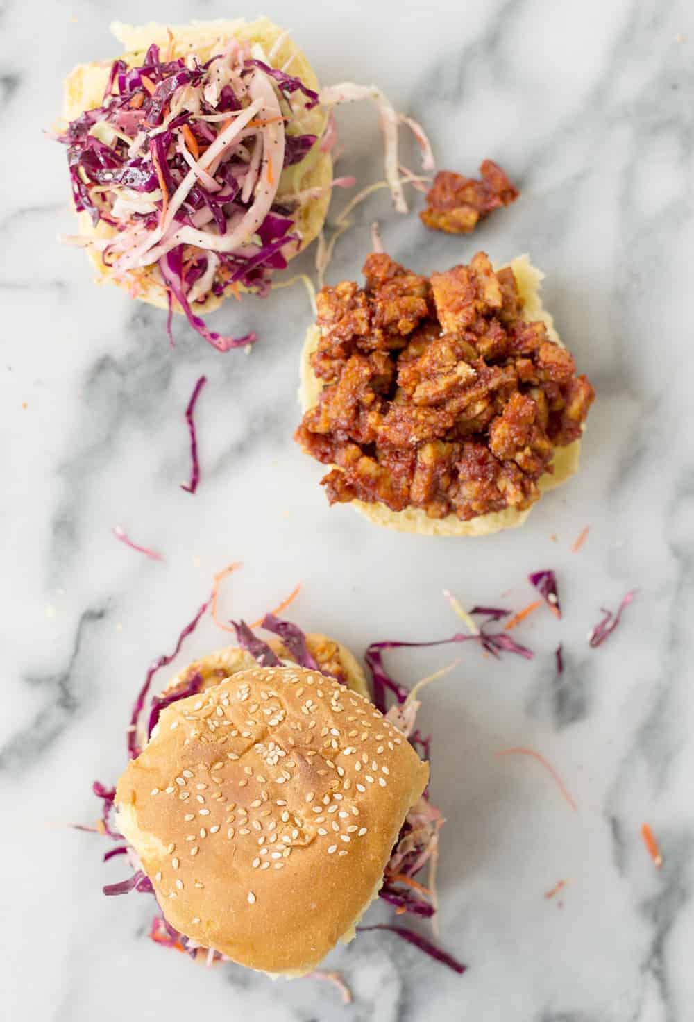 An Open Sandwich Showing The Bbq Tempeh And Coleslaw