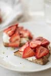 Balsamic Strawberry Ricotta Toast. The perfect breakfast for this time of year. Balsamic soaked berries spooned onto thick toast with orange ricotta. | delishknowledge.com