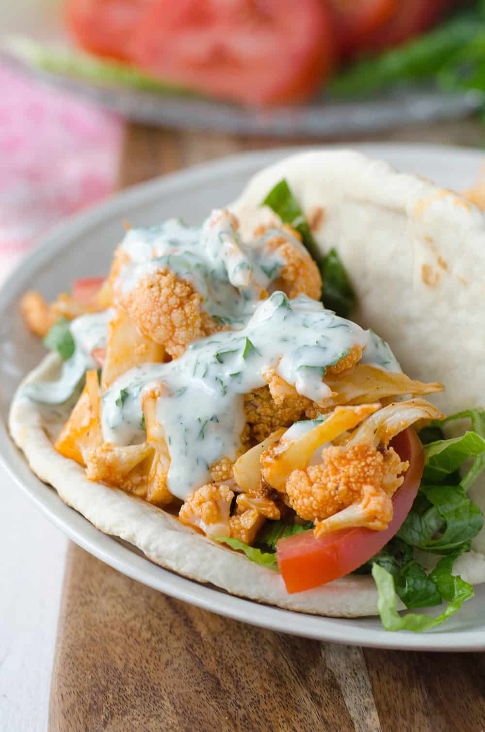 Buffalo Cauliflower Flatbreads! These Vegan Sandwiches Are Packed With So Much Flavor! Roasted Buffalo Cauliflower On Homemade Flatbreads. Topped With A Simple Dairy-Free Ranch Dressing. | Www.delishknowledge.com