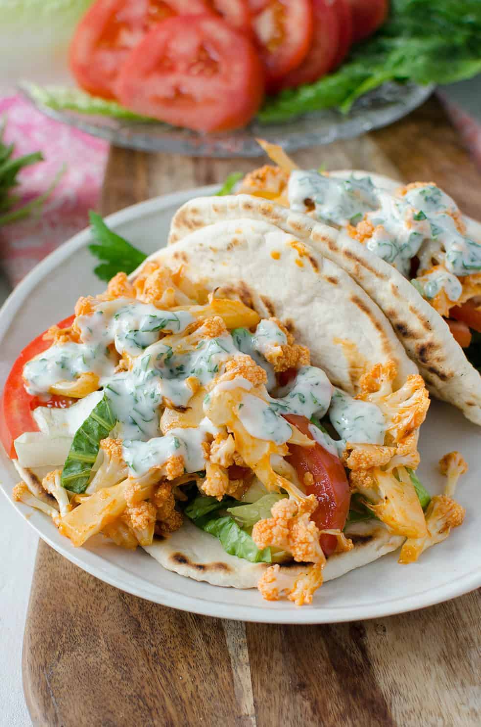 Buffalo Cauliflower Flatbreads! These Vegan Sandwiches Are Packed With So Much Flavor! Roasted Buffalo Cauliflower On Homemade Flatbreads. Topped With A Simple Dairy-Free Ranch Dressing. | Www.delishknowledge.com