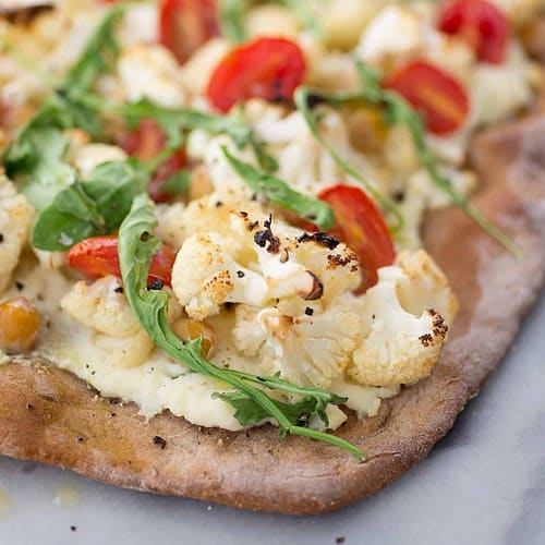 Cauliflower White Pizza. This Cauliflower, Chickpea And Arugula Pizza Is A Delicious Vegetarian Option. So, So Good. | Delishknowledge.com