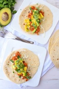 Chipotle Tempeh Tacos! Sauteed tempeh with a spicy chipotle sauce. Topped with a quick mango-pineapple-avocado salad. Vegan & Gluten-Free option. 