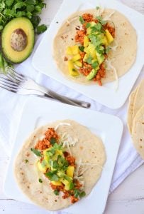 Chipotle Tempeh Tacos! Sauteed tempeh with a spicy chipotle sauce. Topped with a quick mango-pineapple-avocado salad. Vegan & Gluten-Free option. 