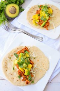 Chipotle Tempeh Tacos! Sauteed tempeh with a spicy chipotle sauce. Topped with a quick mango-pineapple-avocado salad. Vegan & Gluten-Free option. 