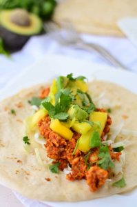 Chipotle Tempeh Tacos! Sauteed tempeh with a spicy chipotle sauce. Topped with a quick mango-pineapple-avocado salad. Vegan & Gluten-Free option. 