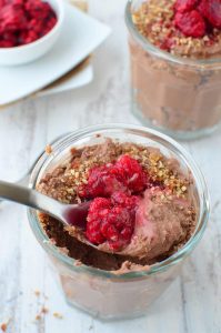 Chocolate Raspberry Mousse Parfait Cups! Healthy chocolate mousse cups layered with date and almond crust. Vegan, gluten-free, and mostly raw.