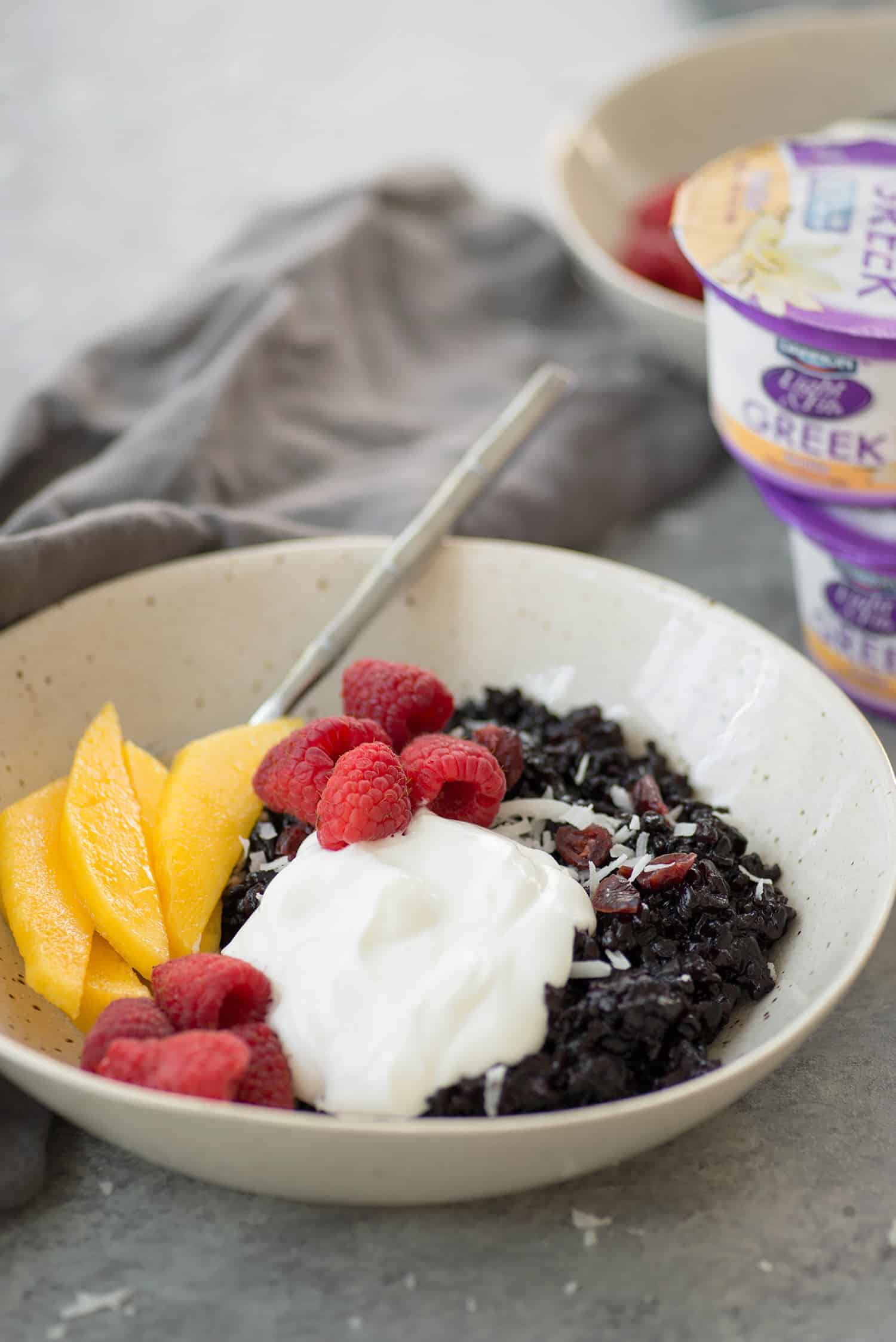 Coconut Black Rice Breakfast Bowls! Sweet black rice porridge topped with yogurt, fresh fruit and toasted coconut.