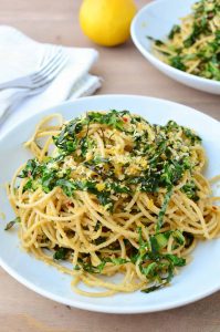 Collard Green Pasta! Shredded collards tossed with hot pasta, garlic, olive oil, red pepper flakes and seasoned bread crumbs. Dinner is ready in just 20 minutes! Vegan | www.delishknowledge.com