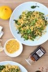 Collard Green Pasta! Shredded collards tossed with hot pasta, garlic, olive oil, red pepper flakes and seasoned bread crumbs. Dinner is ready in just 20 minutes! Vegan | www.delishknowledge.com