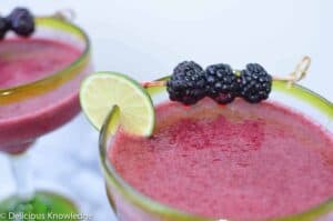 Garnish with lime slices and fresh blackberries 