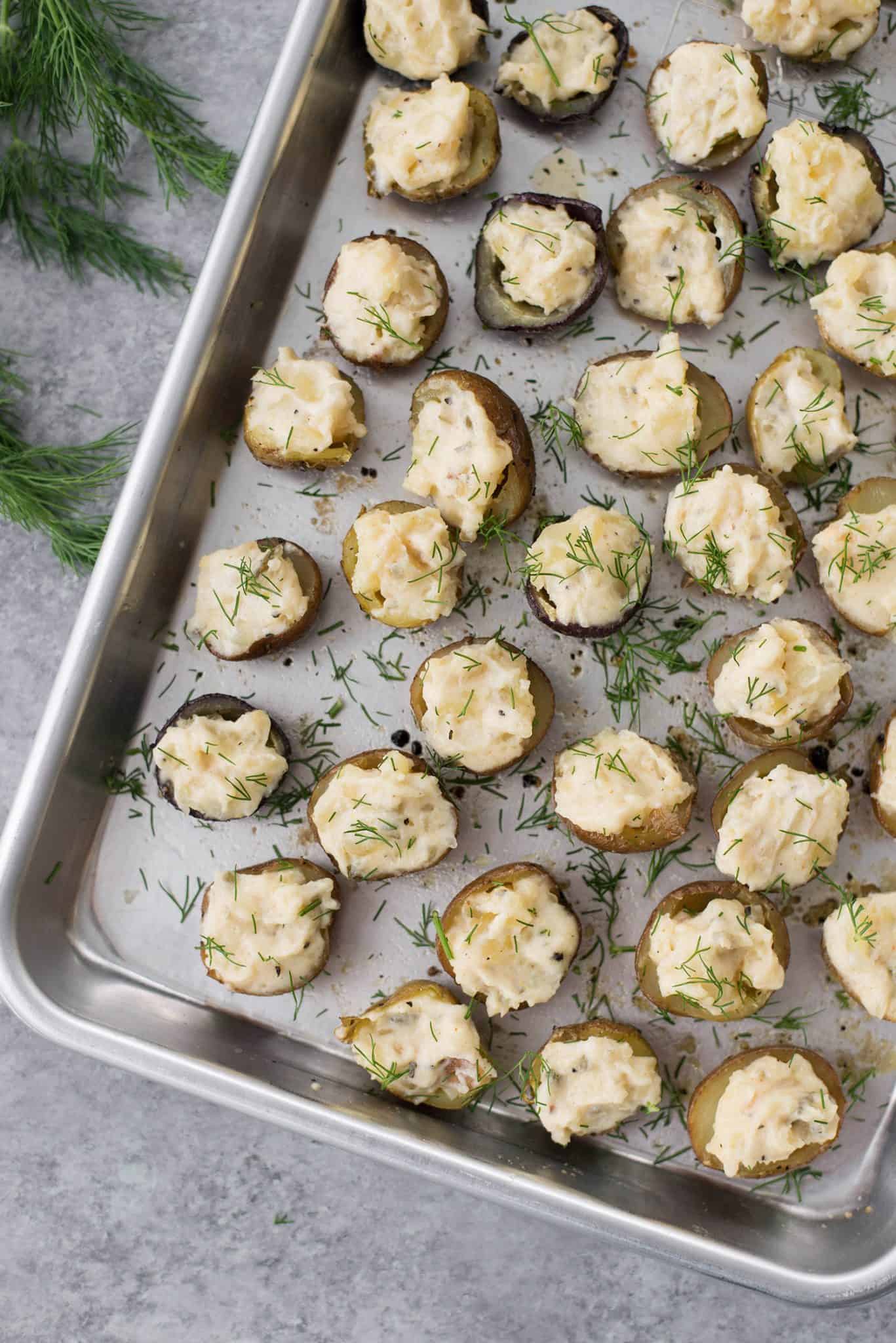 Deviled Potatoes! These mini potatoes are the perfect Spring appetizer. Crispy potato shells stuffed with deviled dill potato filling. Vegan and Gluten-Free. | www.delishknowledge.com