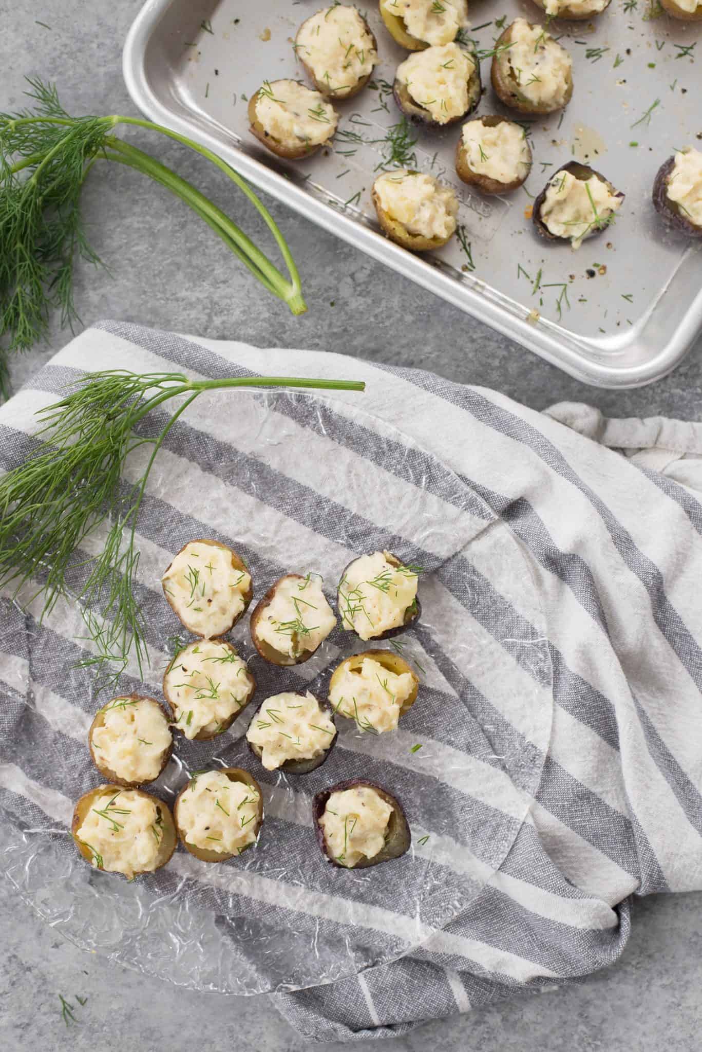 Deviled Potatoes! These mini potatoes are the perfect Spring appetizer. Crispy potato shells stuffed with deviled dill potato filling. Vegan and Gluten-Free. | www.delishknowledge.com
