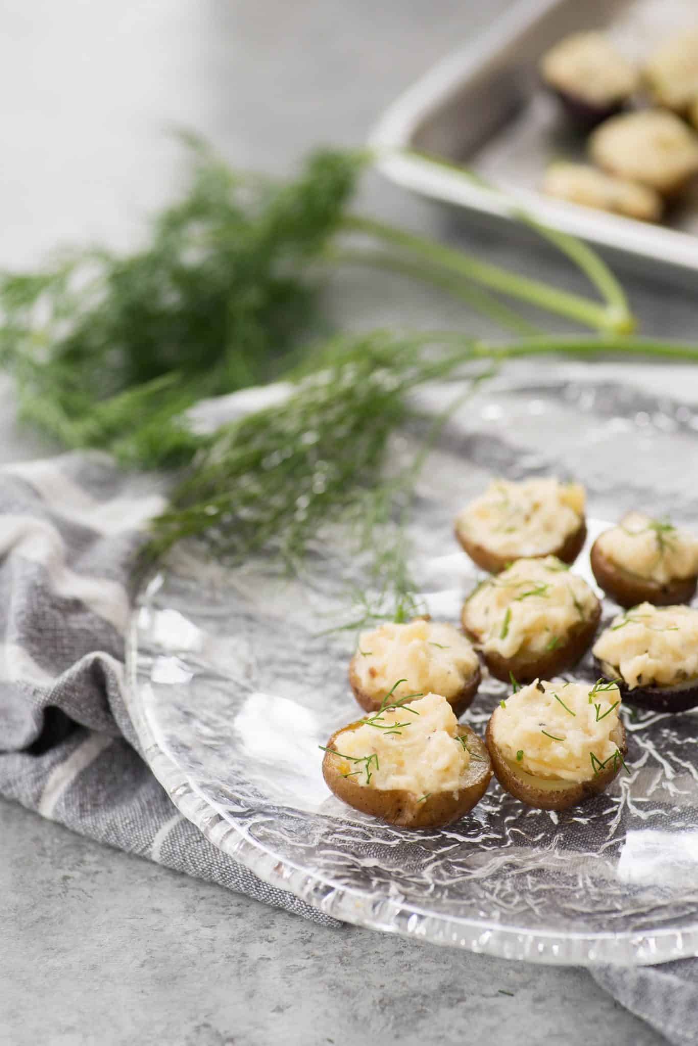 Deviled Potatoes! These mini potatoes are the perfect Spring appetizer. Crispy potato shells stuffed with deviled dill potato filling. Vegan and Gluten-Free. | www.delishknowledge.com