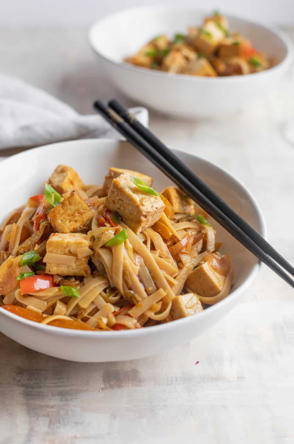 Bowl Of Drunken Noodles With Tofu And Chopsticks