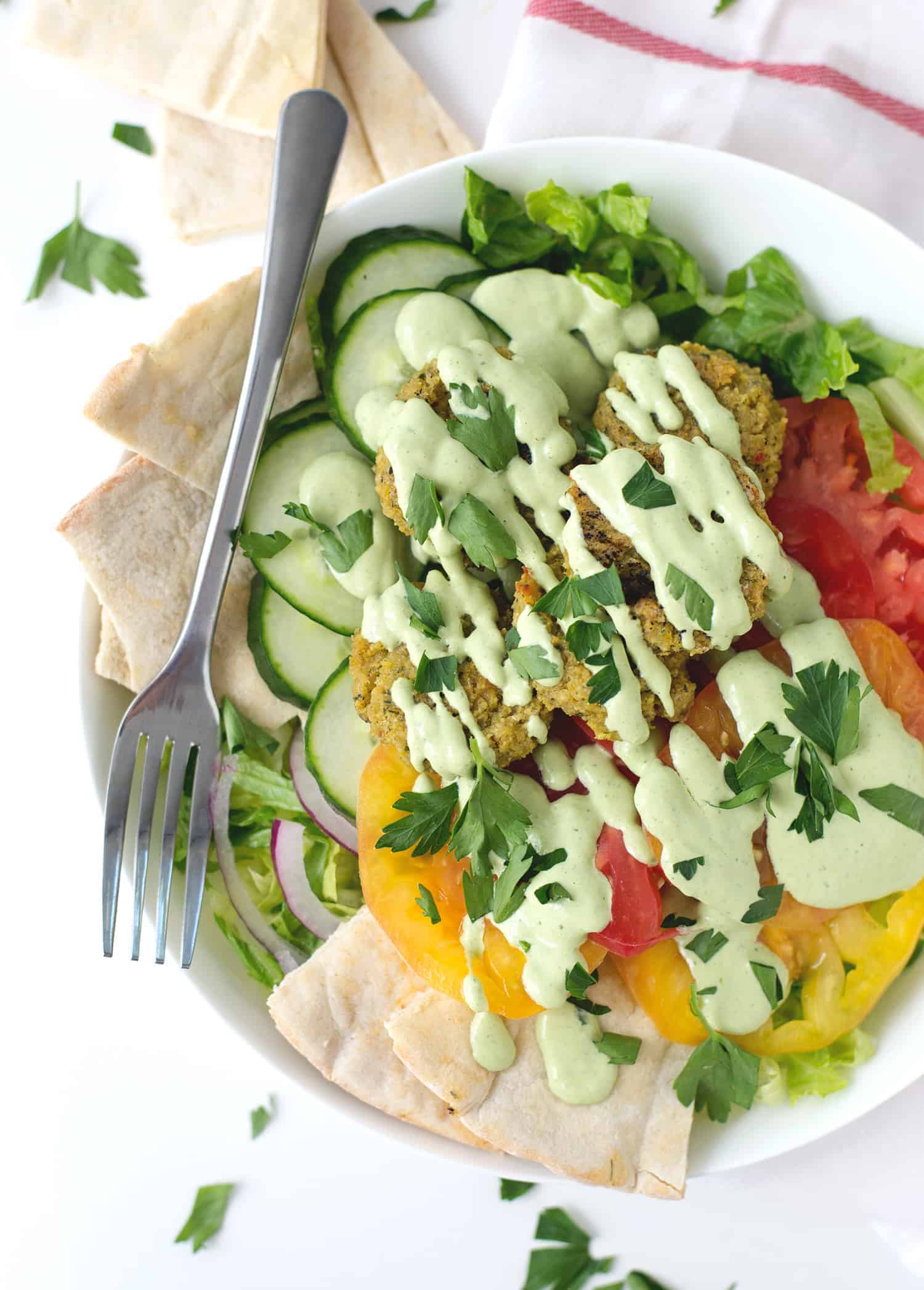 Falafel Salad With Tahini Parsley Dressing! Crispy Vegan Falafel Patties On Top Of Salad With Tahini Parsley Dressing. | Www.delishknowledge.com