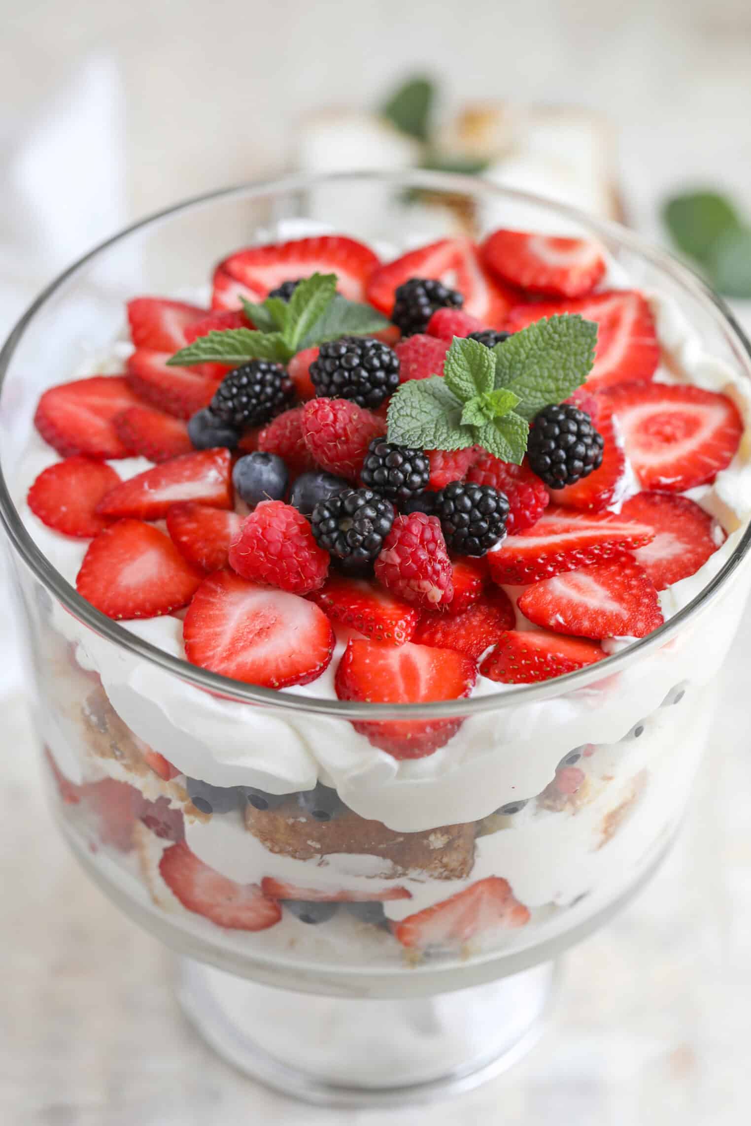Fresh Berry Trifle 12 A Glass Trifle Bowl Filled With Layers Of Whipped Cream, Sliced Strawberries, Blueberries, And Cake Creates A Stunning Berry Trifle, Topped With Fresh Strawberries, Blackberries, Raspberries, And A Sprig Of Mint.