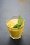 Frozen Mango Lassi! This smoothie is so refreshing for hot summer days. Mango, turmeric, ginger, coconut and honey. | delishknowledge.com