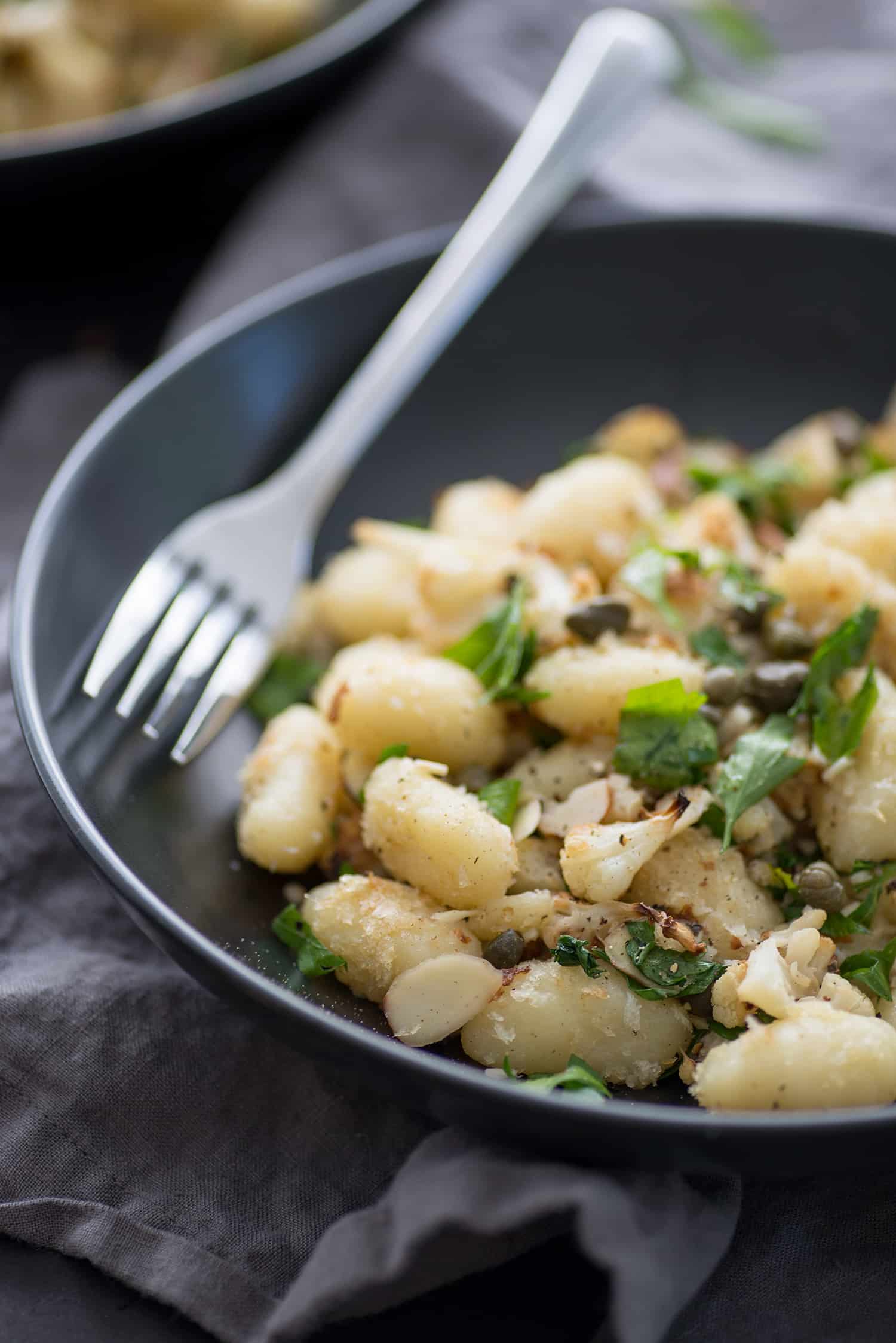 Vegan Gnocchi With Roasted Cauliflower And Lemon! This Dinner Is Perfect For Fall; Crispy Roasted Cauliflower, Capers, Garlic Breadcrumbs, Gnocchi And Fresh Lemon Juice. A Must-Make. | Www.delishknowledge.com 