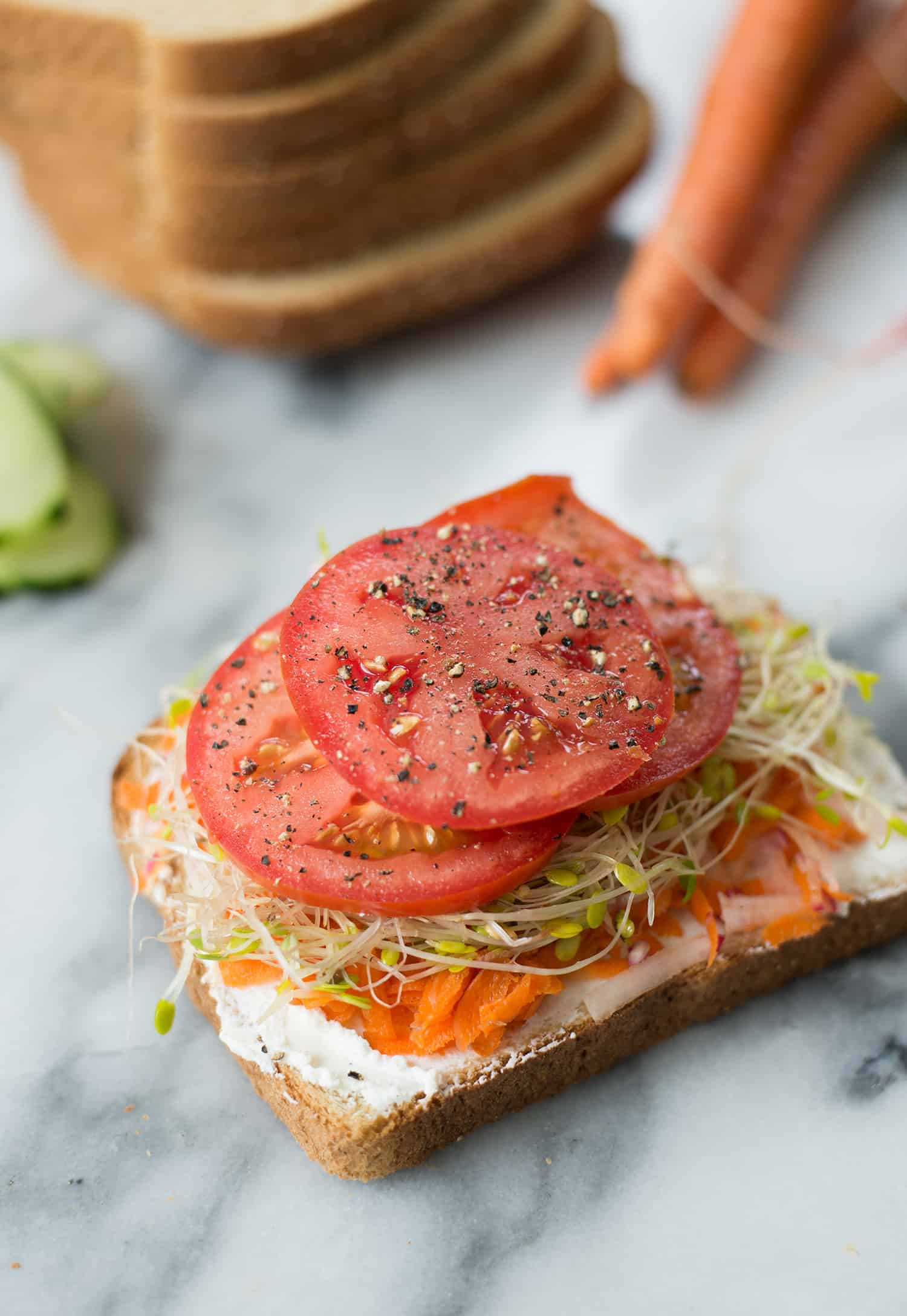 Green Goddess Veggie Sandwich! This Sandwich Is Layered With Flavor And Packed With Vegetables! Homemade Green-Goddess Dressing, Tomatoes, Sprouts, Avocado, Goat Cheese, Radish, Carrots. Vegetarian, Easily Vegan Or Gluten-Free. | Www.delishknowledge.com