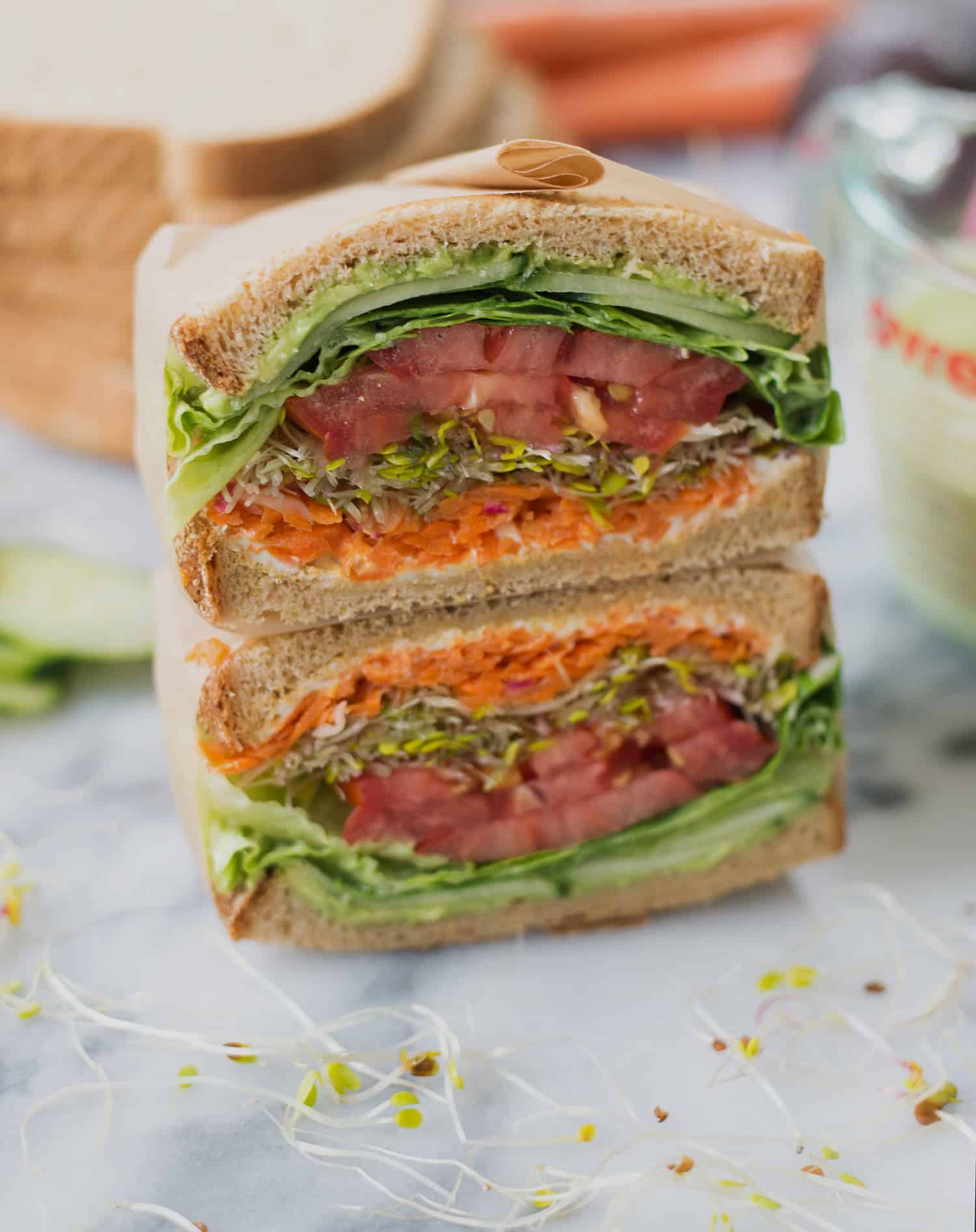 Green Goddess Veggie Sandwich! This Sandwich Is Layered With Flavor And Packed With Vegetables! Homemade Green-Goddess Dressing, Tomatoes, Sprouts, Avocado, Goat Cheese, Radish, Carrots. Vegetarian, Easily Vegan Or Gluten-Free. | Www.delishknowledge.com