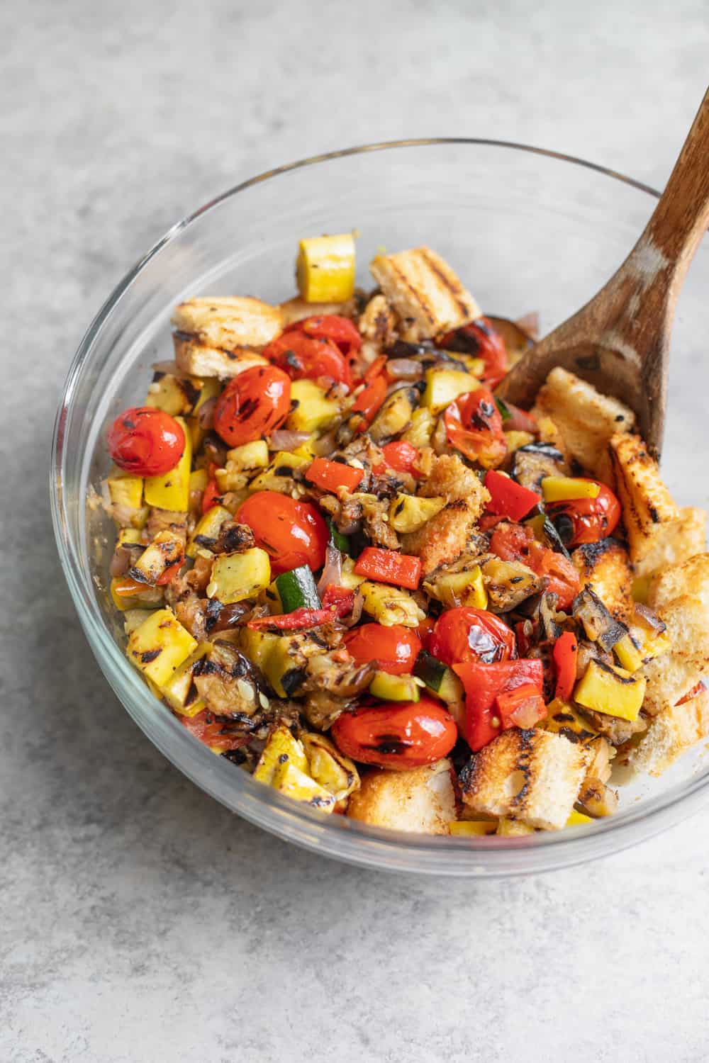 Close Up Shot Of Grilled Panzanella Salad With Basil Dressing 