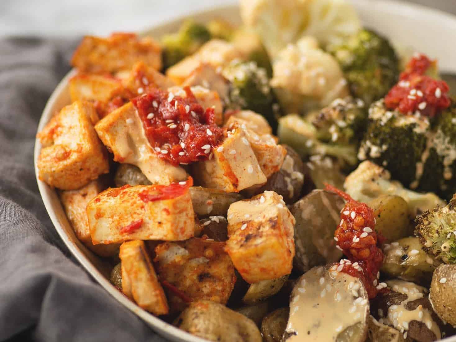 Harissa Tahini Tofu Buddha Bowls! Harissa Roasted Tofu, Roasted Potatoes, Broccoli And Cauliflower Covered In A Tahini Harissa Dressing. Grain-Free, Vegan And Gluten-Free. | Www.delishknowledge.com