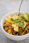 Instant Pot Enchilada Casserole. Yummy, vegetarian and gluten-free! Cooked quinoa, beans, corn and corn tortillas in a homemade enchilada sauce. Delicious! #mexican #dinner #recipe #healthy #glutenfree #vegetarian #quinoa #weeknight | www.delishknowledge.com