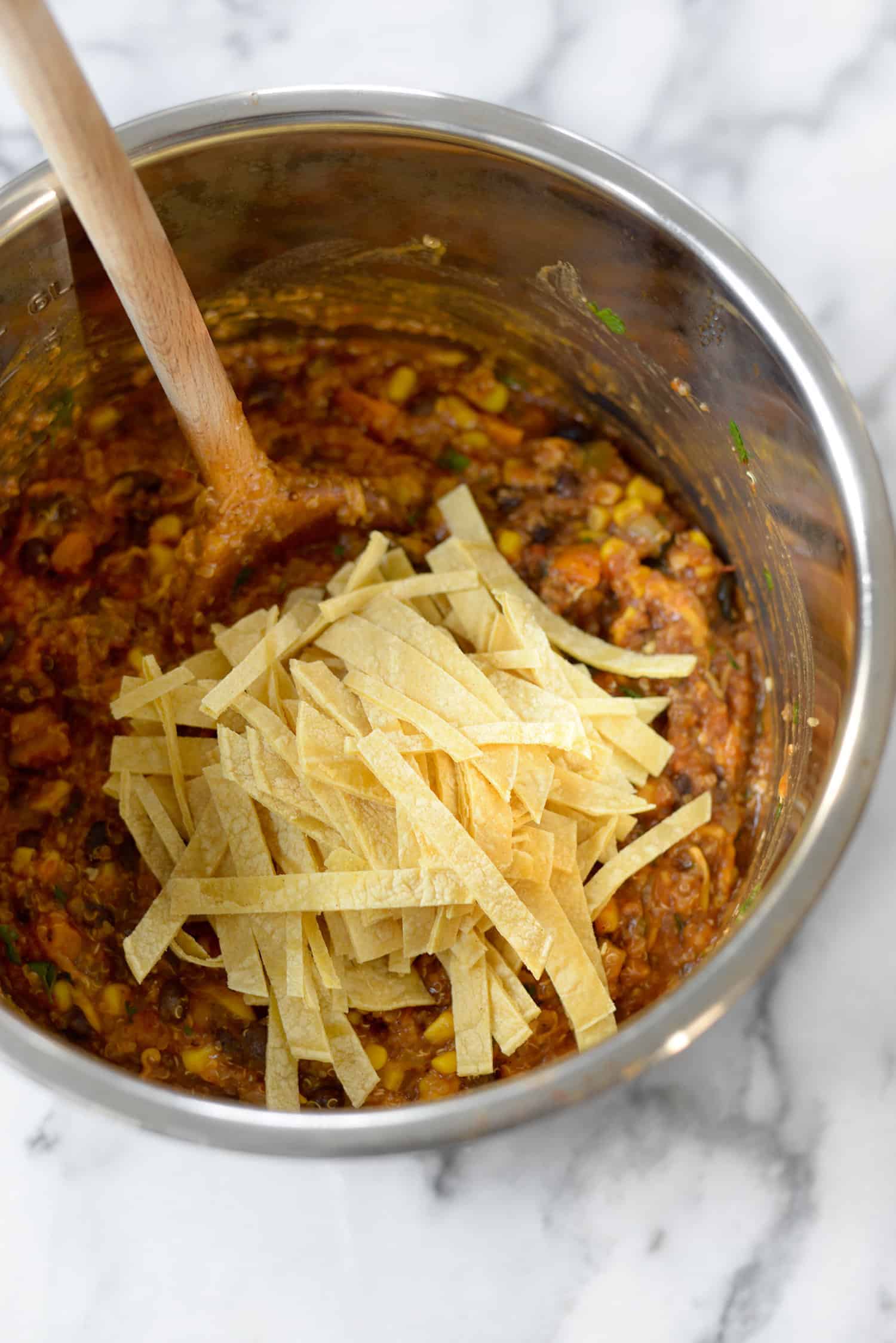 Instant Pot Enchilada Casserole. Yummy, Vegetarian And Gluten-Free! Cooked Quinoa, Beans, Corn And Corn Tortillas In A Homemade Enchilada Sauce. Delicious! #Mexican #Dinner #Recipe #Healthy #Glutenfree #Vegetarian #Quinoa #Weeknight | Www.delishknowledge.com