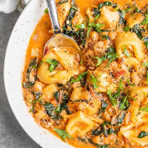 Close Up Of Shot Of Tortellini In Tomato Broth