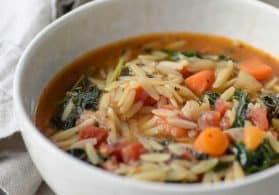 bowl of vegan italian kale and orzo soup