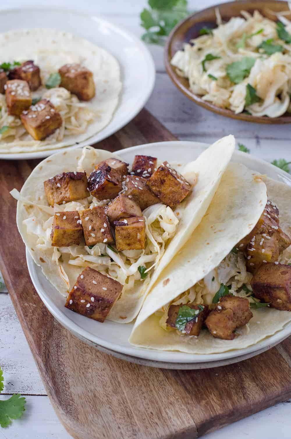 korean tacos with slaw and plates