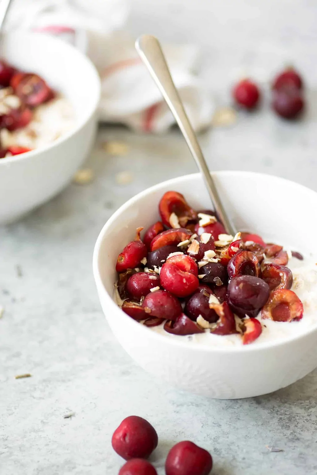Lavender Cherry Overnight Oats! This breakfast is so unique and delicious, a must-try with fresh cherries. Homemade cashew-lavender milk with oats, cherries and almonds. Vegan and Gluten-Free | www.delishknowledge.com