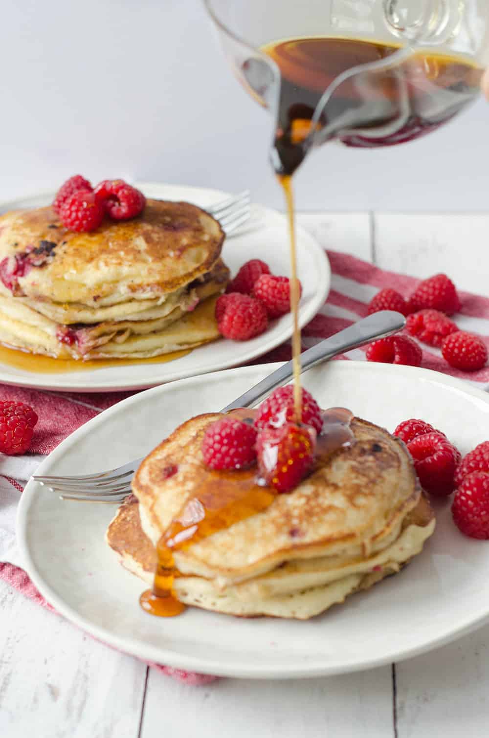 Lemon Raspberry Pancakes, Perfect For Valentines Day Brunch! Soft And Fluffy Pancakes Infused With Lemon Zest And Frozen Raspberries. | Www.delishknowledge.com