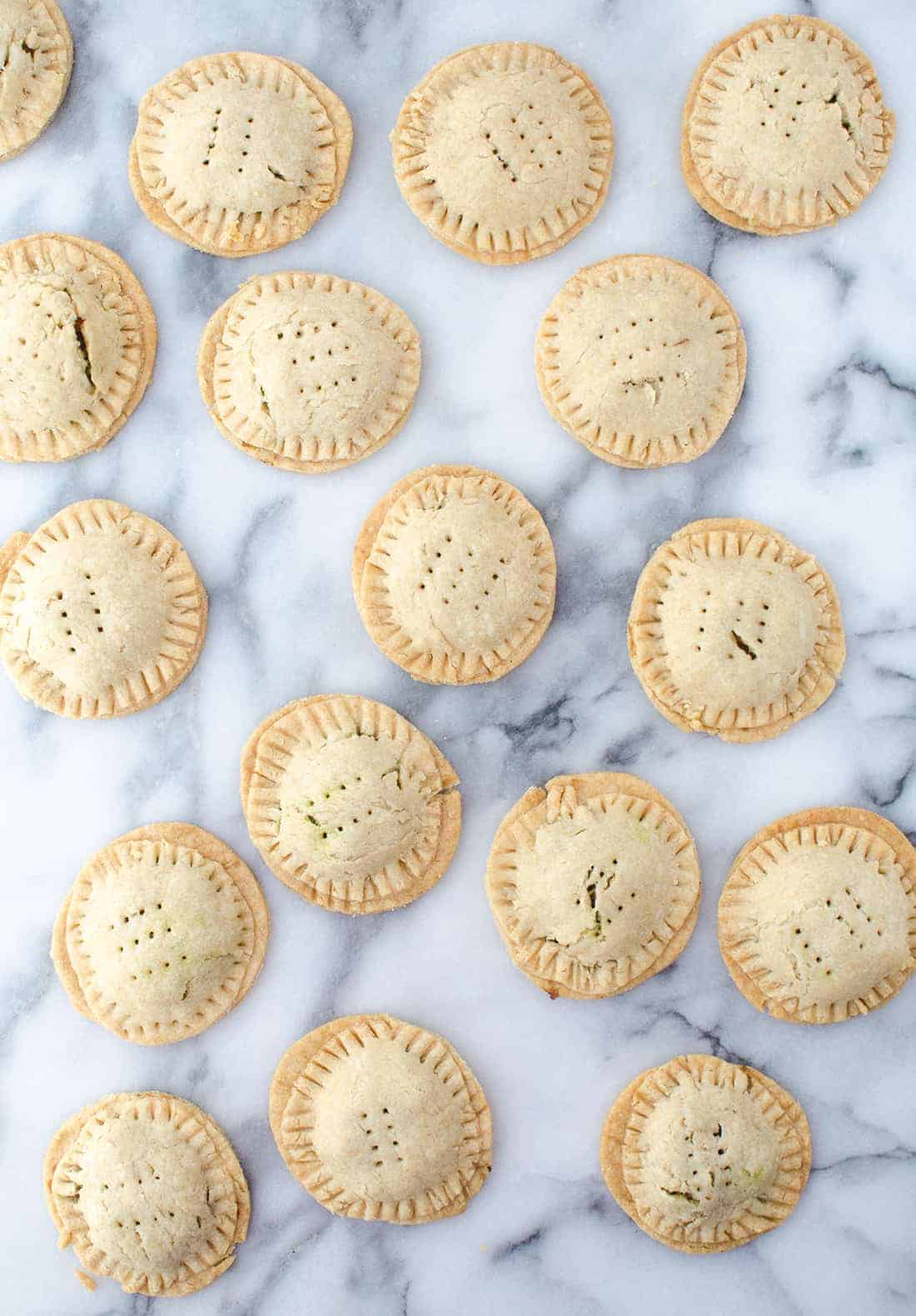 Lentil Hand Pies with Walnut Pesto! Lentil salad stuffed into homemade pie crust. Perfect for picnics, potlucks or lunches! #vegan | www.delishknowledge.com