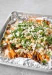 Loaded Greek Sweet Potato Fries! Crispy sweet potato fries with feta, chickpeas, parsley and a lemon-tahini sauce. Vegetarian and gluten-free | www.delishknowledge.com