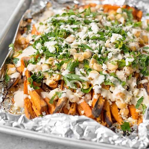 Loaded Greek Sweet Potato Fries! Crispy Sweet Potato Fries With Feta, Chickpeas, Parsley And A Lemon-Tahini Sauce. Vegetarian And Gluten-Free | Www.delishknowledge.com