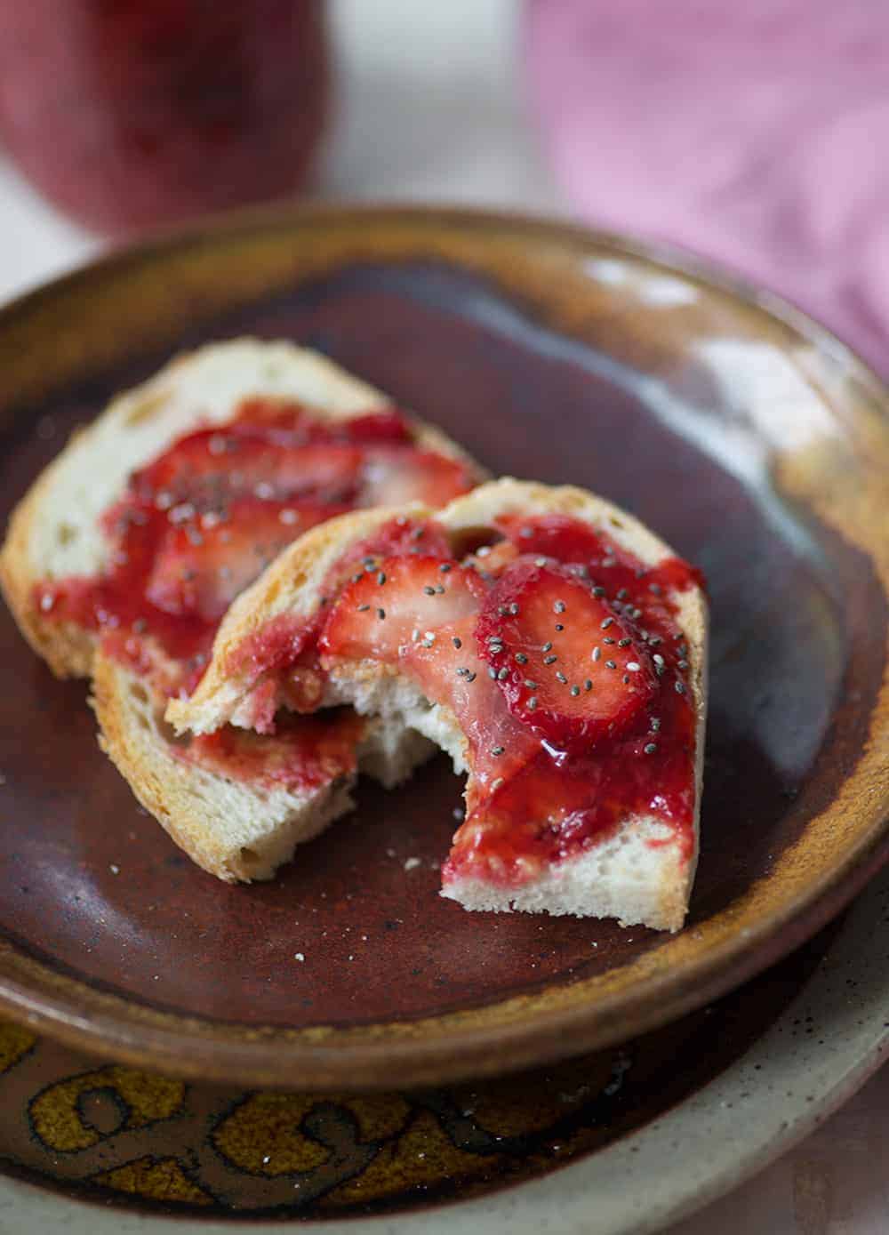 toast and fresh strawberry jam on plate