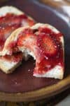 sourdough toast with strawberry jam on plate