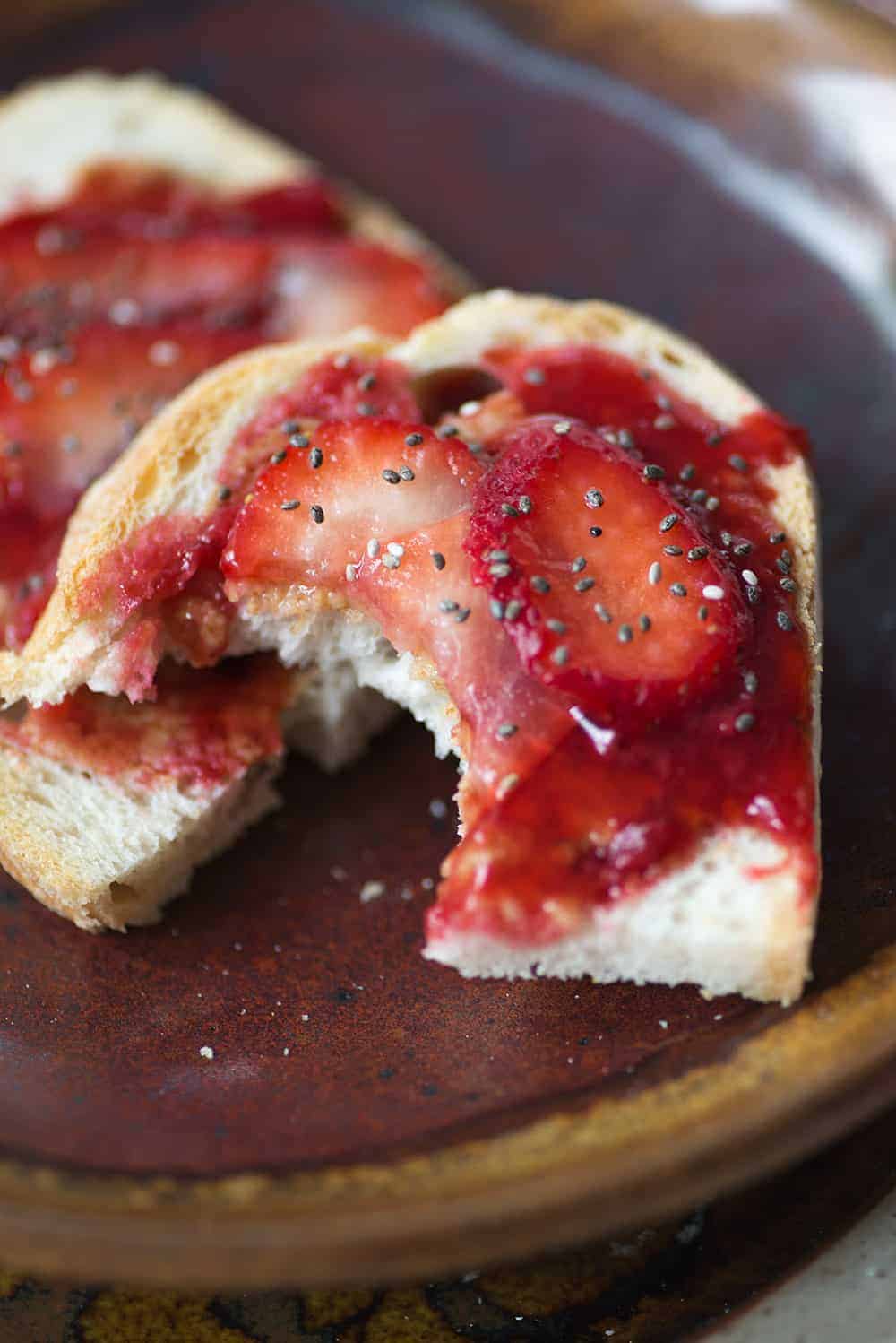 sourdough toast with strawberry jam on plate