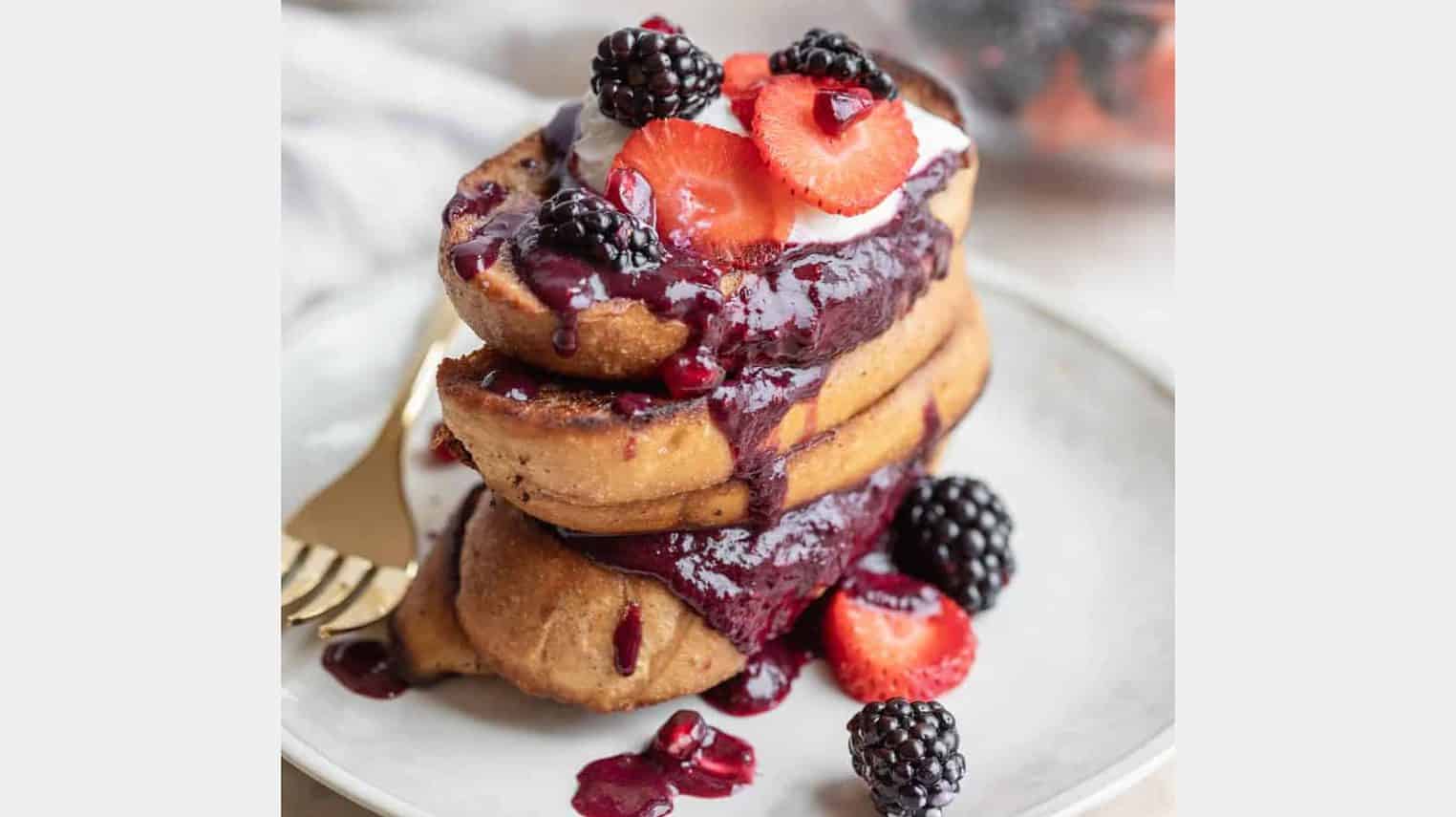 stack of french toast with berry sauce