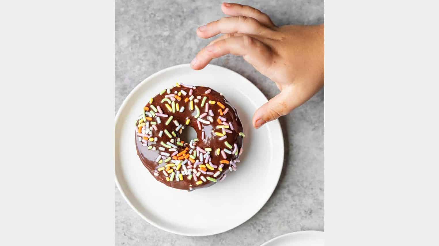 vegan breakfast donuts with a hand